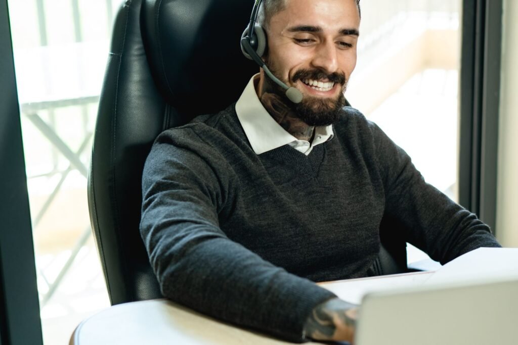 Customer support representative wearing headset at office